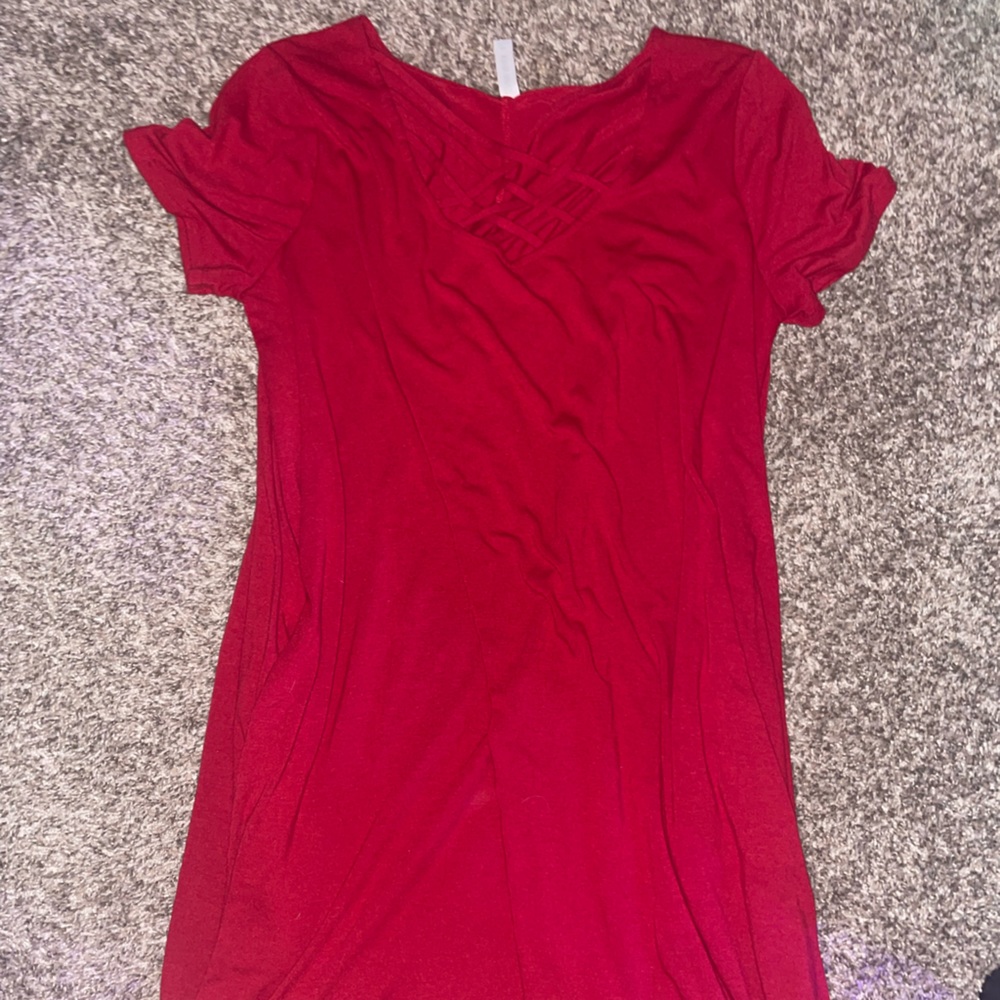 Red dress with pockets. Crisscross detailing on the front